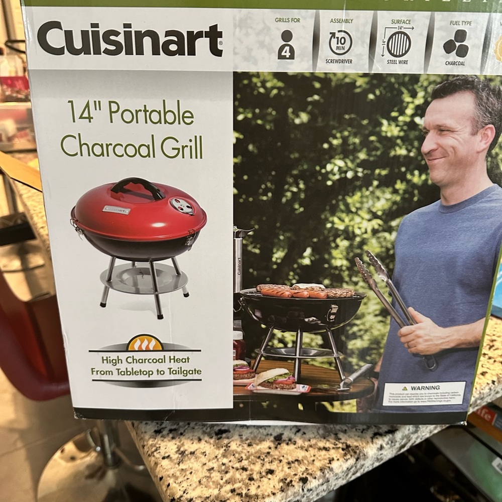 New in Box Cruisinart 14” portable tabletop/tail gate charcoal grill.
